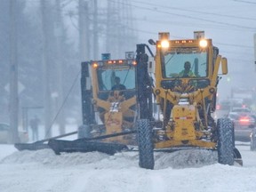 City councillors are raising concerns about a city proposal to wait for more snowfall before sending out plows. Wayne Cuddington/Postmedia