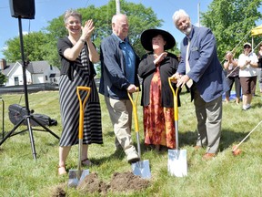 Marietta Drost, executive director of L’Arche London (left), L’Arche resident Janet Blair with her father Jim Blair (middle), and David McKane, campaign steering committee member, break ground on the future site of the L’Arche London Gathering Place in London Ont. June 29, 2016. CHRIS MONTANINI\LONDONER\POSTMEDIA NETWORK