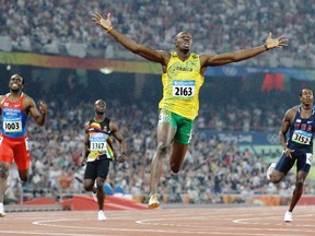 Jamaica's Usain Bolt crosses the finish line to win the gold in the men's 200m final at the 2008 Summer Olympics in Beijing. (Anja Niedringhaus/AP Photo/Files)