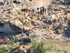 A white sheet possibly covering a 2nd body found in the rubble on Thursday June 30, 2016.  A house exploded earlier this week  in Mississauga. Photo supplied by Farhad Parsi.