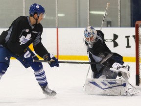 Toronto Maple Leafs goalie James Reimer makes a save on Jared Cowen (29) during practice Wednesday February 24, 2016. (Postmedia Network file photo)