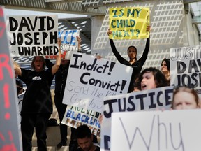 Protesters attend a rally at Austin City Hall in response to the recent fatal police shooting of David Joseph, 17, Thursday, Feb. 11, 2016, in Austin, Texas.  (AP Photo/Eric Gay)