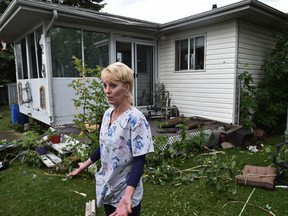 Shelley Dedio's home took the brunt of the severe weather caused by a possible tornado which caused damaged to homes and trees as flying debris damaged neighbouring homes in Ponoka, Friday, June 30, 2016. Ed Kaiser/Postmedia