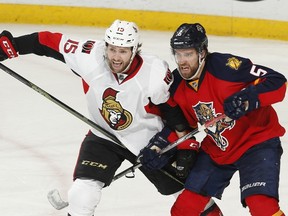 Aaron Ekblad (right) of the Florida Panthers battles for position with Zack Smith of the Ottawa Senators at the BB&T Center in Sunrise, Florida. (Joel Auerbach/Getty Images/AFP)