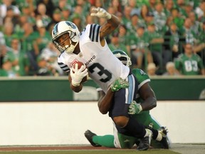 Argos running back Brandon Whitaker tries to break free of a tackle during last night's 30-17 win in Regina. (The Canadian Press)