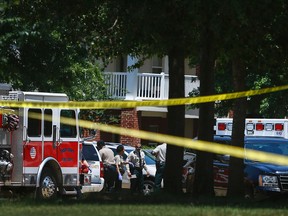 Shelby County Sheriff’s deputies work the scene where four young children were fatally stabbed at the Greens of Irene apartment, Friday, July 1, 2016 in Memphis, Tenn.  Four young children were stabbed to death in a gated apartment complex in suburban Memphis on Friday, and police took their mother into custody for questioning.  (Mark Weber/The Commercial Appeal via AP)