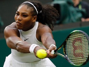Serena Williams returns to Christina McHale during their match at Wimbledon in London, Friday, July 1, 2016. (AP Photo/Ben Curtis)