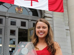 Virginia Weese, a Grade 11 student at Regiopolis-Notre Dame Catholic High School, is awarded the 2016 Mayor’s Award for Youth Volunteerism outside City Hall  in Kingston, Ont. on Friday July 1, 2016. Weese was recognized for her work in helping fundraise $10,000 to help bring a Syrian refugee family to Kingston. Julia McKay/The Whig-Standard/Postmedia Network