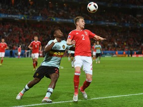 Chris Gunter of Wales and Michy Batshuayi of Belgium compete for the ball during the UEFA EURO 2016 quarter final match between Wales and Belgium at Stade Pierre-Mauroy on July 1, 2016 in Lille, France. (Photo by Michael Regan/Getty Images)