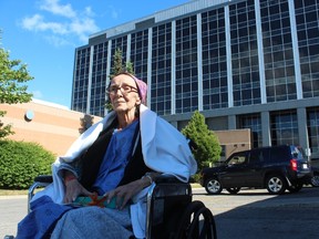 Cancer patient Marilyne Brennan, 61, is upset by the London Health Sciences Centre's new smoking rules that require her to leave hospital property for a cigarette. (DALE CARRUTHERS, The London Free Press)