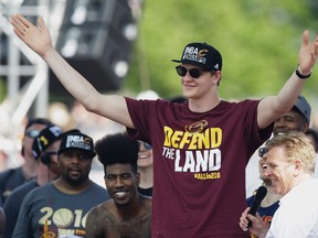 In this Wednesday, June 22, 2016 photo, Cleveland Cavaliers’ Timofey Mozgov acknowledges the crowd during a rally in Cleveland. (AP Photo/Tony Dejak)