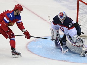 Russia’s Alexander Radulov scores on Slovakia’s goalie Jan Laco in the shootout at the 2014 Winter Olympics in Sochi, Russia, on Sunday February 16, 2014. (Postmedia Network file photo)