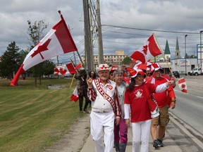 With Karl Habla at the helm, dozens of patriotic Timmins residents marched down Algonquin Boulevard dressed in their finest red-and-white in honour of Canada Day on July 1. The march, which has become an annual tradition, took participants from Timmins city hall to the Schumacher Flag Park to continue the celebrations.
