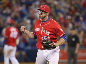 Bo Schultz of the Toronto Blue Jays celebrates after getting an out during his team's game against the Cleveland Indians on July 1, 2016 at Rogers Centre in Toronto. (TOM SZCZERBOWSKI/Getty Images/AFP)