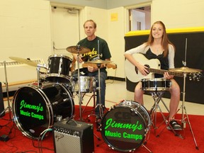Music instructor Jimmy Fuller and mentor/musical assistant Sydney Sollen, a Grade 8 student at Aberader Central School, are helping kids kick out the jams this summer. Jimmy's Music Camps is hosting a rock'n'roll summer camp at the Camlachie United Church July 11 to 15. Carl Hnatyshyn/Postmedia Network