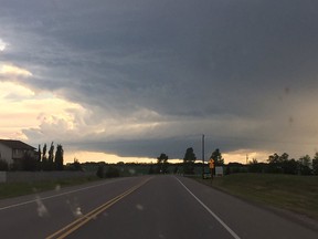Storm cell over the Town of Didsbury on Friday, July 1, 2016. Environment Canada says a tornado likely touched down. Photo courtesy Beth Allen @adolwyn