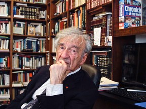 In this Sept. 12, 2012, photo Elie Wiesel is photographed in his office in New York. Wiesel, the Nobel laureate and Holocaust survivor has died.  His death was announced Saturday, July 2, 2016, by Israel's Yad Vashem Holocaust Memorial. (AP Photo/Bebeto Matthews)