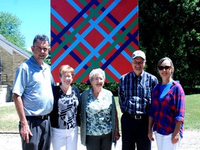 A barn quilt that was once at the farm of settlers Duncan and Isabel McKillop on Talbot Line in West Elgin was officially unveiled Wednesday after being moved to the Eagle Community Centre. In front of the quilt are, from left - Brian Masschaele, diector of cultural services, Elgin county; Janet Given, president of the Eagle Community Centre; Betty McKillop, Mike Baker, Elgin County Museum curator; and Beth McLellan, daughter of Betty McKillop.