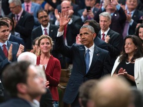 U.S. President Barack Obama waves after addressing Parliament, as Canada's Prime Minister Justin Trudeau (left) and his wife Sophie Gregoire Trudeau look on, at Parliament Hill in Ottawa on Wednesday, June 29, 2016. THE CANADIAN PRESS/Justin Tang