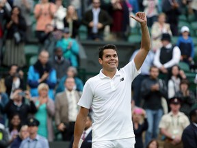 Milos Raonic celebrates after beating Jack Sock in their men's singles match at the Wimbledon Tennis Championships in London on Saturday, July 2, 2016. (Tim Ireland/AP Photo)