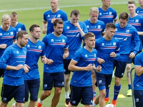 Players attend a training session of Iceland's soccer team at their base camp in Annecy, France on Thursday, June 30, 2016. Iceland will face France in a Euro 2016 quarterfinal match in Paris on Sunday. (Michael Probst/AP Photo)