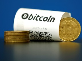 A Bitcoin (virtual currency) paper wallet with QR codes and a coin are seen in an illustration picture taken May 27, 2015. REUTERS/File Photo