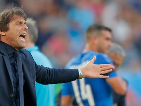 Italy coach Antonio Conte shouts from the sidelines during the Euro 2016 quarterfinal against Germany at the Nouveau Stade in Bordeaux, France, Saturday, July 2, 2016. (AP Photo/Antonio Calanni)