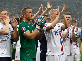 Iceland’s players applaud supporters at the end of their Euro 2016 quarterfinal against France at the Stade de France in Saint-Denis, north of Paris, France, Sunday, July 3, 2016. (AP Photo/Thibault Camus)