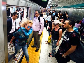 Commuters on a crowded platform at the Bloor-Yonge subway station. (STAN BEHAL, Toronto Sun)