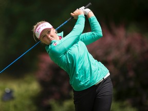 Brooke Henderson hits a tee shot on the third hole during the final round of the LPGA Cambia Portland Classic Sunday, July 3, 2016, in Portland, Ore. (AP Photo/Troy Wayrynen)