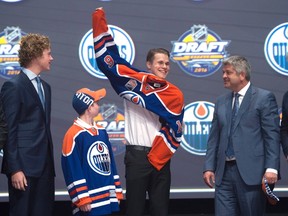 Jesse Puljujarvi, shown here on stage at the 2016 NHL draft, says he will likely be skating again in a month. (AP Photo)