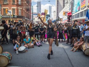 Black Lives Matter stage a sit-in at Yonge and College Sts. during the Pride Parade on July 3, 2016. (Mark Blinch/The Canadian Press)