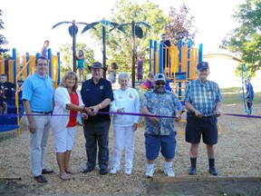 LKM MPP Monte McNaughton, Strathroy-Caradoc mayor Joanne Vanderheyden, and members of the Mt. Brydges Lions Club during the opening ceremony of the new playground in Mt. Brydges on Wednesday, June 29. Photo taken from the Strathroy-Caradoc Facebook page.