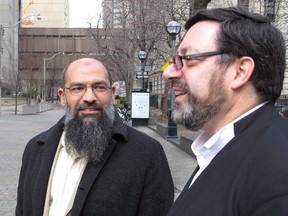 Egyptian national Mohamed Mahjoub, left, is seen with lawyer Paul Slansky outside Federal Court in Toronto on  Dec.7, 2012. (Colin Perkel/The Canadian Press)