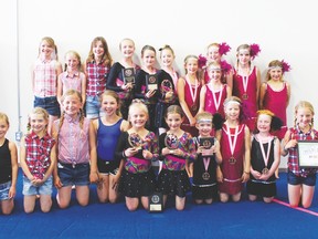 Pictured above is the Rhythmic group (in pink and black), the Gymfest participants in the plaid shirts and the Artistic gymnasts in the jazz outfits.