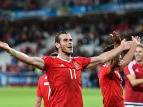 Wales' Gareth Bale celebrates at the end of the Euro 2016 quarterfinal match between Wales and Belgium at the Pierre Mauroy stadium in Villeneuve d’Ascq, near Lille, France, on Friday, July 1, 2016. (Martin Meissner/AP Photo)