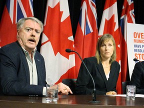 From left, Sarnia Mayor Mike Bradley, Keep Hydro Public spokesperson Katrina Miller and Whitby Councillor Chris Leahy call for a larger public debate on the partial sale of Hydro One during a Queen's Park media conference on Monday September 28 2015. Antonella Artuso/Toronto Sun/Postmedia Network