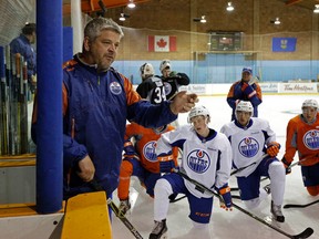 Todd McLellan offers some instruction to the players at the Oilers Orientation Camp Monday in Jasper. (Larry Wong)