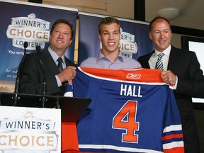 SEPTEMBER 8, 2010 -- left-right: Oilers GM Steve Tambellini, Taylor Hall and Oiler President of Operations Kevin Lowe during jersey number presentations. Taken on September 8, 2010 in Edmonton. FILE