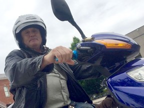 Rick Eybel sits on his e-bike. Eybel was successful in getting charges and $11,000 in fines dismissed after he was stopped by police for having a broken pedal. (Bill Sawchuk/Postmedia Network)