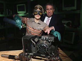 Director/producer Ivan Reitman poses for a photo in Ghostbusters Headquarters with a Madame Tussauds figure of Ghostbuster Jillian Holtzmann (portrayed by Kate McKinnon) inside Madame Tussauds New York highly-anticipated all new Ghostbusters Experience on June 29, 2016 in New York City.  (Photo by Cindy Ord/Getty Images for Madame Tussauds)