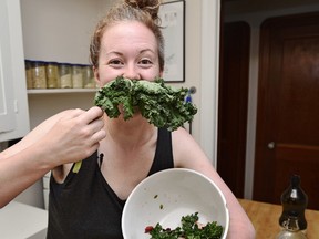Alexis Hillyard showing off her kale mustache after making a kale, strawberry salad with cranberries, pumpkin seeds and dressing. She does an amazing YouTube video cooking series called Stump Kitchen.