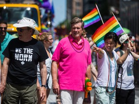 Mayor John Tory (in the pink shirt) at Sunday's Pride parade. (ERNEST DOROSZUK, Toronto Sun)