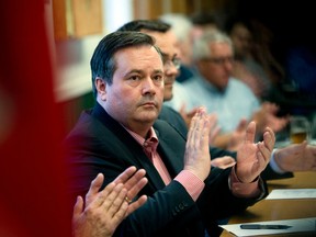 Calgary Conservative MP Jason Kenney applauds as other speakers are announced during a meeting of Alberta Can't Wait, a group hoping to unite the right in the province, at the Royal Canadian Legion in Cochrane Wednesday June 29, 2016. (Ted Rhodes/Postmedia)