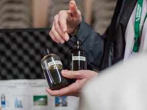 Two types of crude oil that would be trasported through the Northern Gateway pipeline are shown during a community engagement night hosted at the Legion Hall on Wednesday October 15, 2014 in Whitecourt, Alta. (Adam Dietrich/Whitecourt Star/QMI Agency)