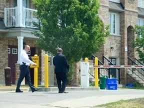 Investigators at the scene of Monday night's shooting in Ajax. (NICK WESTOLL, Toronto Sun)