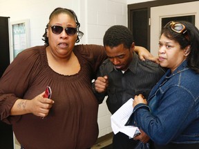 An emotional Joshua Blunt, center, is surrounded by family members after being released from the Grenada County Jail in Grenada, Miss., Tuesday, May 24, 2016. (AP Photo/Rogelio V. Solis)