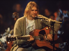 Frances Bean Cobain is fighting her ex husband over her dad's guitar, shown above in Nirvana's Unplugged performance in 1993. (Handout)