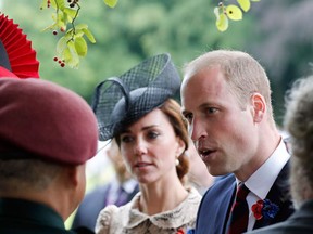 Britain's Prince William, the Duke of Cambridge,  right, and his wife Kate, the Duchess of Cambridge, talk with soldiers in the cemetery of the World War I Thiepval Monument during the Somme centenary commemorations in Thiepval, northern France, Friday, July 1st, 2016. One week after Britain's vote to leave the European Union, Prime Minister David Cameron and royal family members will stand side-by-side with France's President to celebrate their historic alliance at the centenary of the deadliest battle of World War I. (AP Photo/Francois Mori, Pool)