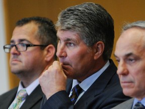 Former Bruins and Avalanche star Ray Bourque is flanked by attorneys Eric Salach (left) and Gerald Laflamme at district court in Lawrence, Mass., on Wednesday, July 6, 2016, where he acknowledged in court that he was operating under the influence of alcohol when he rear-ended another vehicle in Andover last month. (Tim Jean/Eagle-Tribune via AP/Pool)